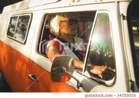 Man driving camper van Man driving camper van 34358020