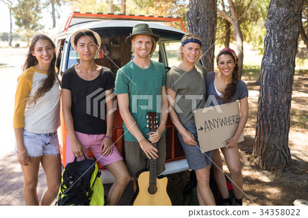 Portrait of friends with sign board 34358022