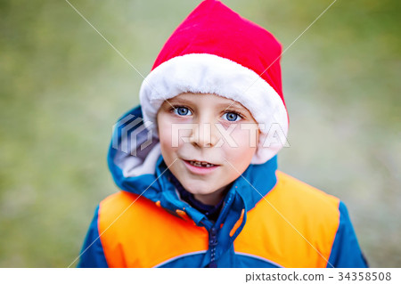 Cute little kid boy with Santa Claus hat Cute little kid boy with Santa Claus hat 34358508