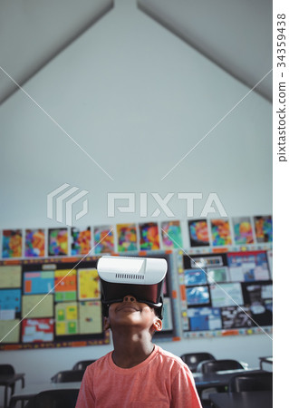 Boy with virtual reality simulator in school Boy with virtual reality simulator in school 34359438