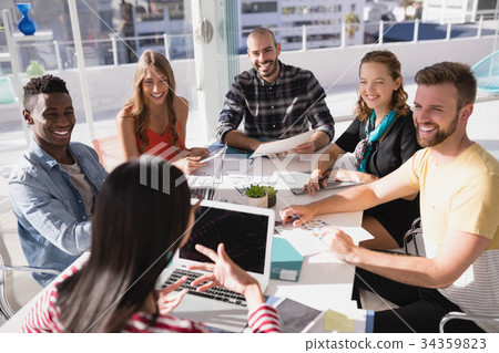 Business executives discussing during meeting 34359823