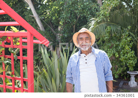 Portrait of man standing by metallic structure Portrait of man standing by metallic structure 34361001