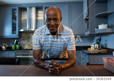 Portrait of senior man with hands clasped 34361044