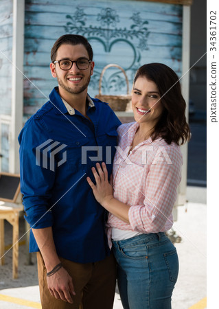 Happy couple standing at cafe Happy couple standing at cafe 34361702