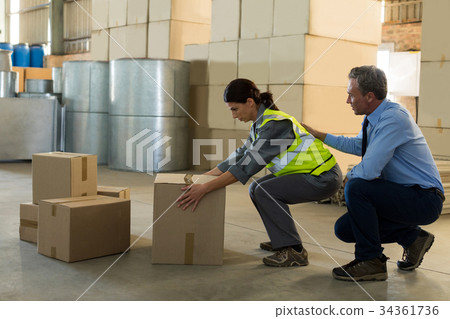 Manager motivating female worker while working Manager motivating female worker while working 34361736