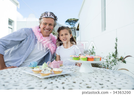 Smiling father and daughter in fairy costume Smiling father and daughter in fairy costume 34363200