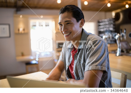 Man sitting in bar 34364648