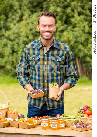 Portrait of man selling organic vegetable 34365518