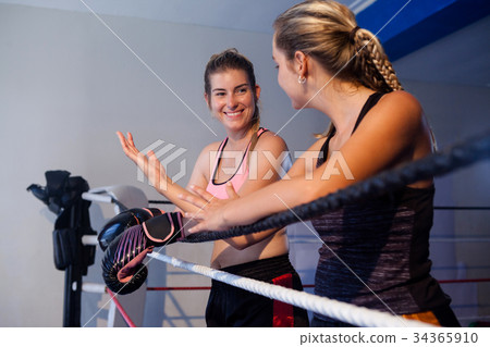 Trainee and coach interacting with each other Trainee and coach interacting with each other 34365910