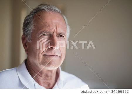 Close-up of thoughtful senior male patient Close-up of thoughtful senior male patient 34366352