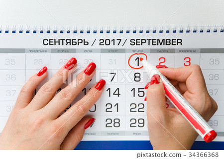 female hand marked the date on September 1. 34366368
