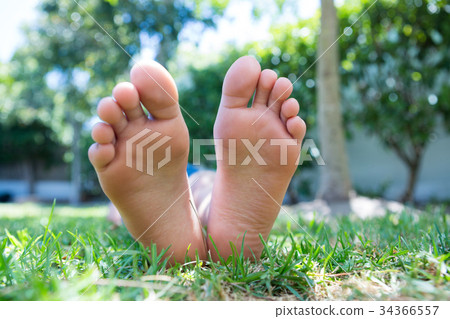 Low section of girl relaxing in yard 34366557
