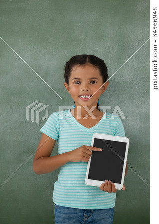 Young girl holding digital tablet Young girl holding digital tablet 34366948