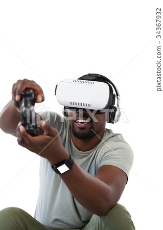 Man using virtual reality headset and playing video game 34367932