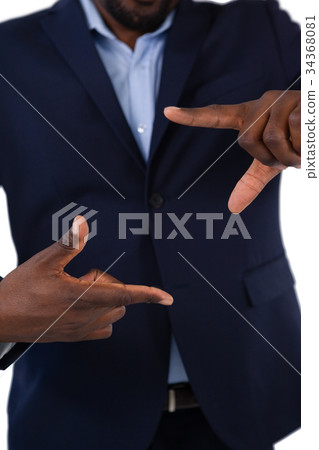 Businessman forming a finger frame 34368081
