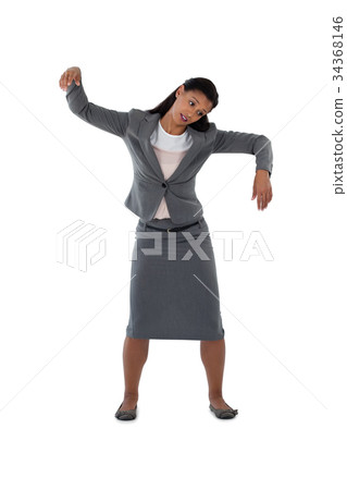 Businesswoman dancing against white background 34368146