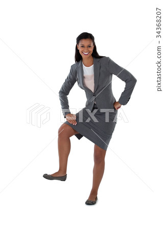 Excited businesswoman dancing against white background Excited businesswoman dancing against white background 34368207