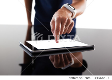 Businesswoman using digital tablet 34368495