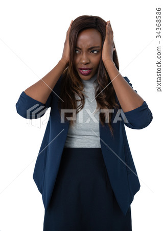 Businesswoman with head in hand looking away 34368586