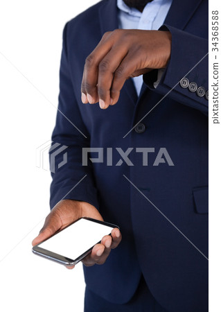 Businessman using mobile phone Businessman using mobile phone 34368588