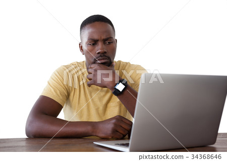 Man using laptop against white background Man using laptop against white background 34368646