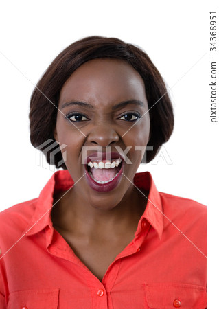 Portrait of young woman shouting 34368951