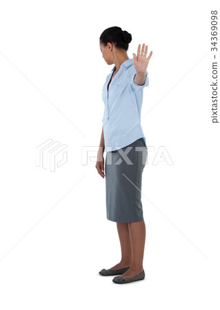 Businesswoman showing her hand while ignoring Businesswoman showing her hand while ignoring 34369098