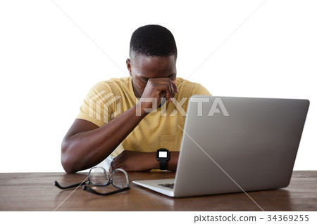 Man using laptop against white background Man using laptop against white background 34369255