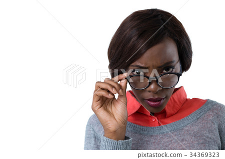 Portrait of young woman wearing eyeglasses Portrait of young woman wearing eyeglasses 34369323