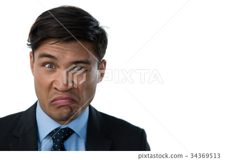 Portrait of businessman making a face Portrait of businessman making a face 34369513