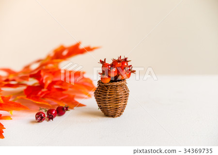 Hawthorn in vase and red maple leaves fall concept Hawthorn in vase and red maple leaves fall concept 34369735