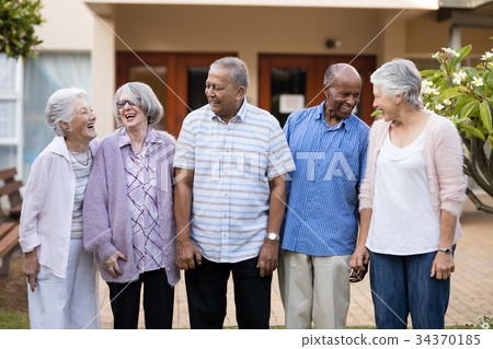 Cheerful senior men and women at nursing home 34370185