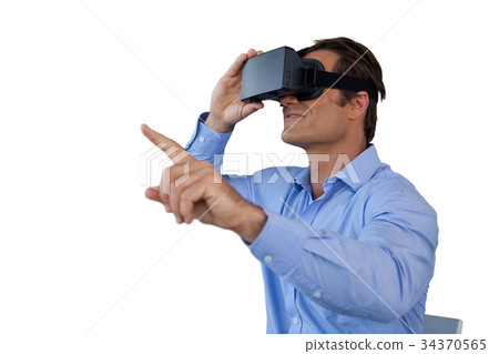 Businessman gesturing while using virtual reality simulator Businessman gesturing while using virtual reality simulator 34370565