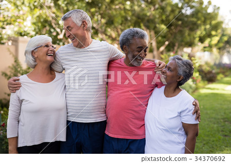 Happy senior couple with friends Happy senior couple with friends 34370692
