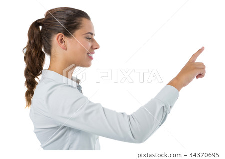 Female executive pressing an invisible virtual screen 34370695