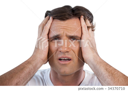 Close up of frustrated mature man with head in hand 34370710