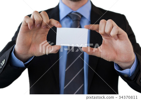Mid section of businessman holding paper Mid section of businessman holding paper 34370811
