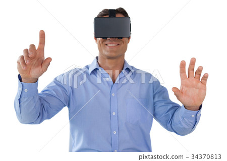 Smiling businessman using vr glasses Smiling businessman using vr glasses 34370813
