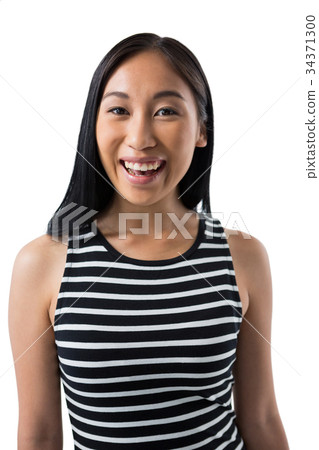Smiling woman standing against white background Smiling woman standing against white background 34371300