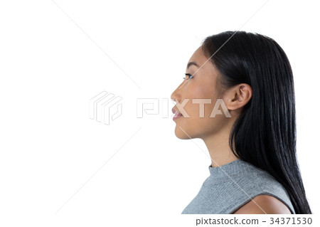 Woman standing against white background 34371530