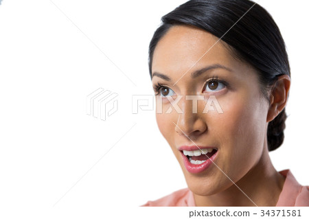 Thoughtful woman against white background 34371581