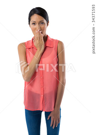 Woman covering her mouth with hand against white background 34371593