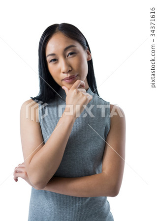 Woman standing against white background 34371616