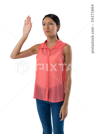 Woman gesturing against white background 34371664