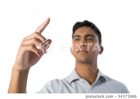 Man pretending to touch an invisible screen 34371666