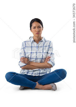 Worried woman sitting with arms crossed 34371670