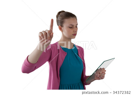 Teenage girl using a glass digital tablet 34372382