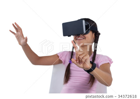 Girl using virtual reality headset 34372618