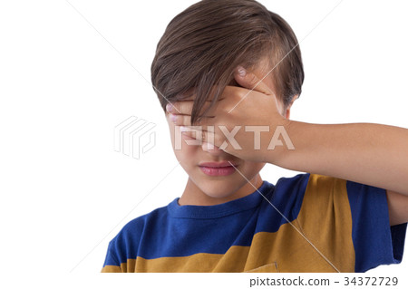 Cute boy covering his eyes 34372729