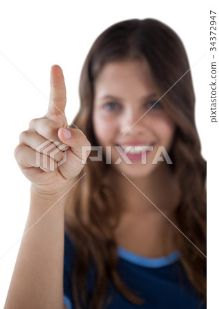 Girl pressing an invisible virtual screen 34372947
